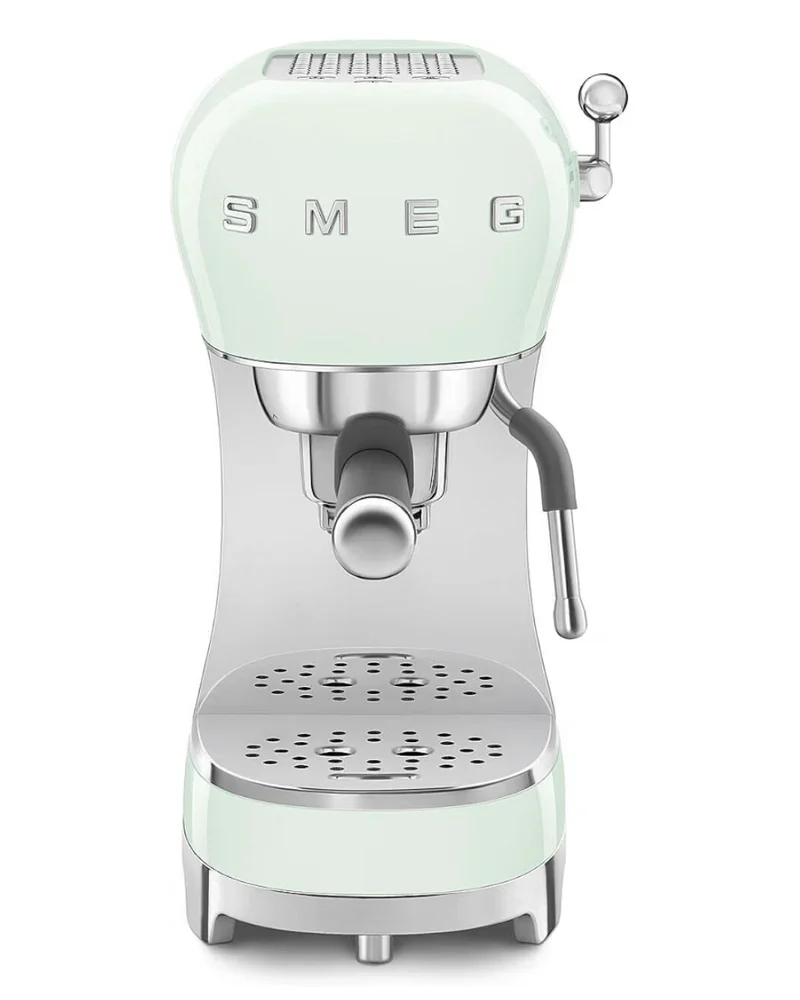 Pastel green Smeg espresso machine with chrome steam wand and drip tray