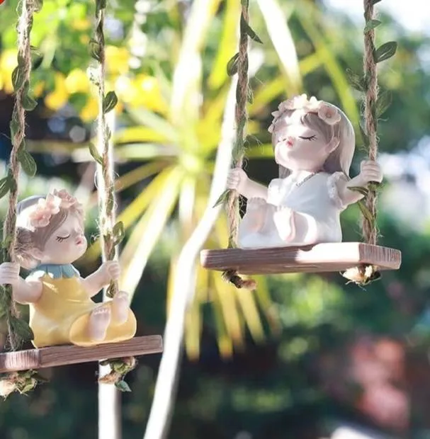 Girl on a swing figurines
