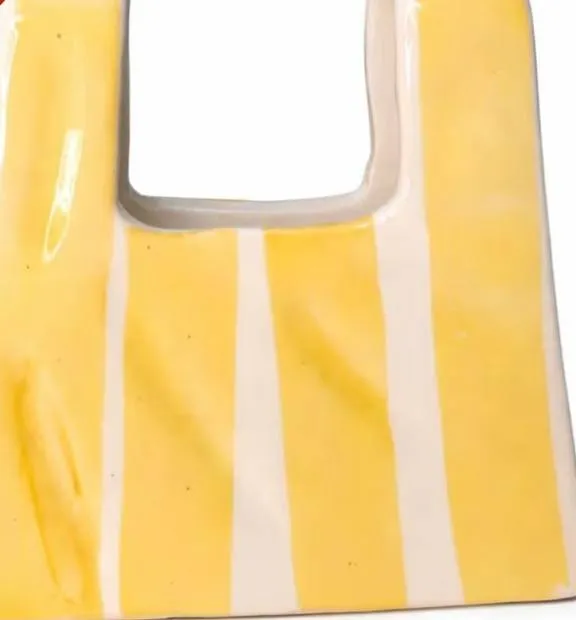 Striped ceramic vase shaped like a paper bag