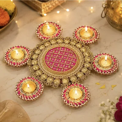 Pink & gold diya rangoli, 7 tealights