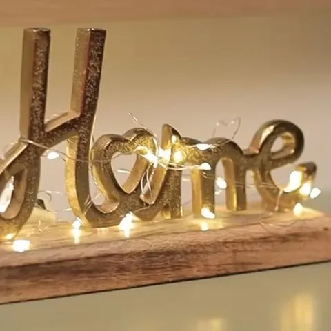 “Home” sign with lights