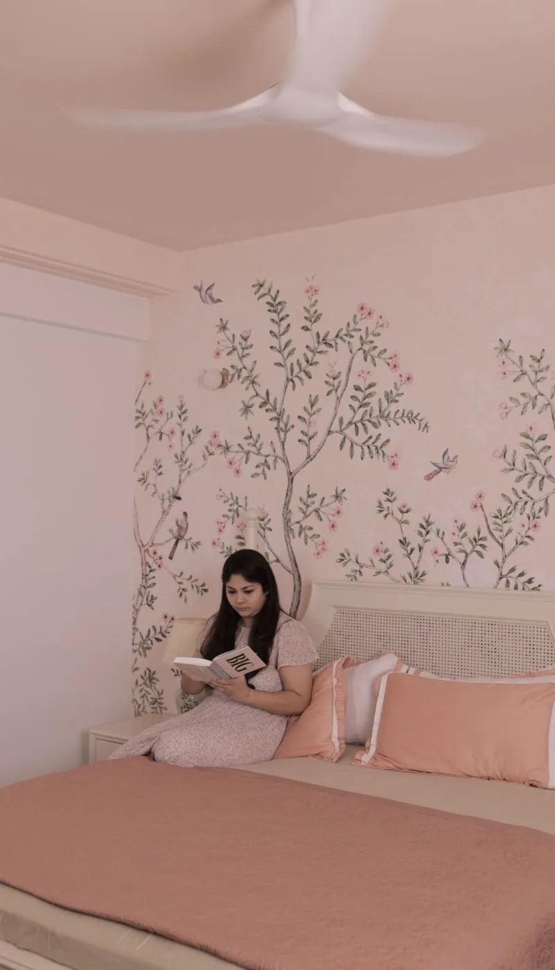 Pink bedroom with a floral chinoiserie wallpaper