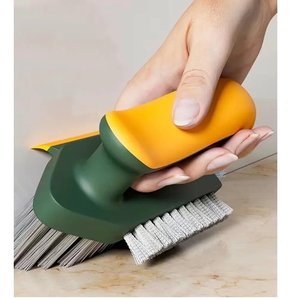 A 4-in-1 tile and grout brush with a narrow crevice head and a rubber squeegee edge