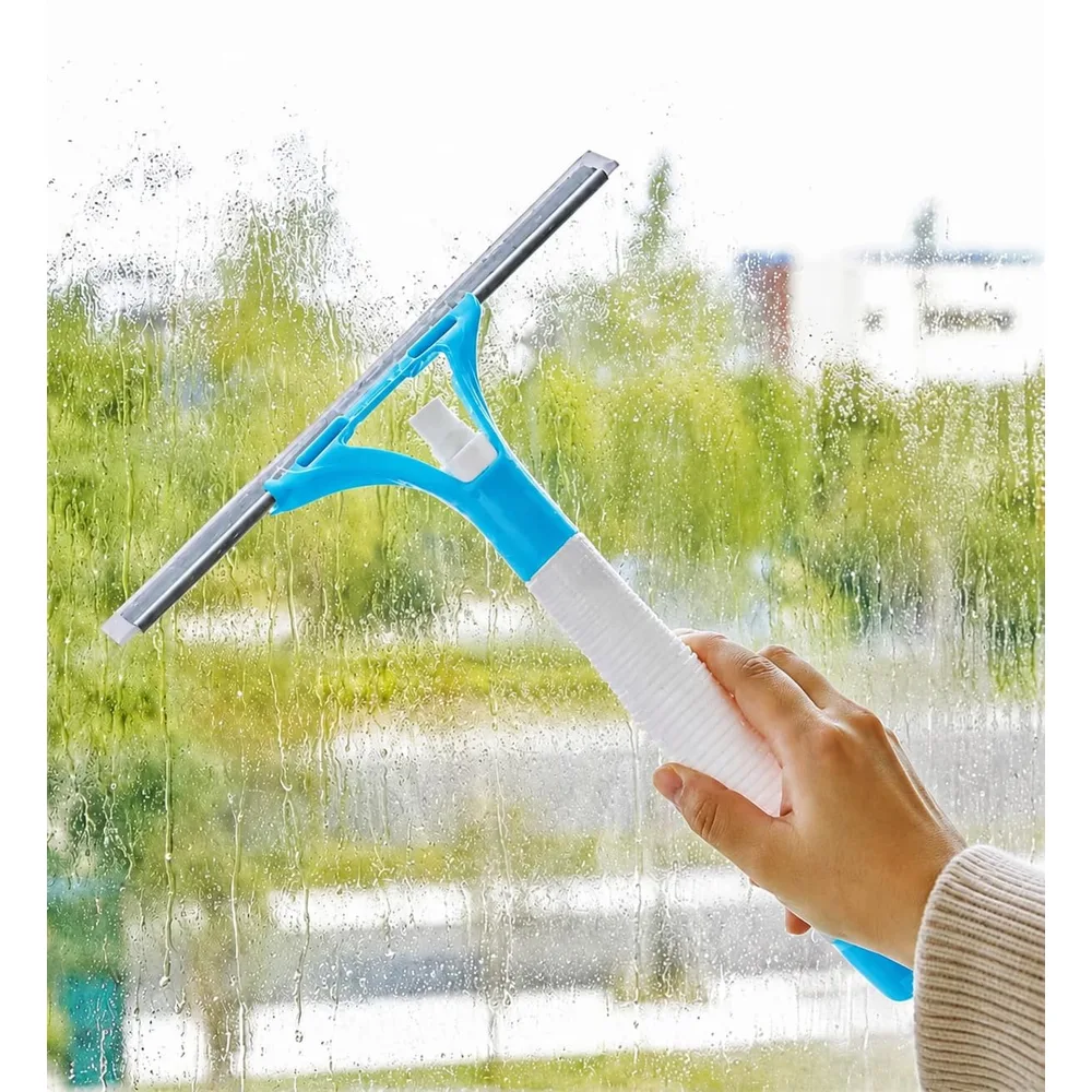 A hand running a blue 2-in-1 spray window washer with a built-in sprayer down a wet window pane