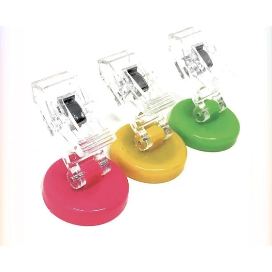 Clear clips on round coloured magnetic bases in pink, yellow and green