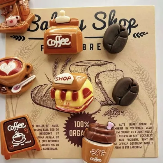 3D coffee cup, coffee bean and bakery shop magnets on a coffee-themed board