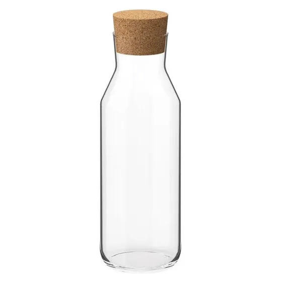 A slim clear glass carafe with a cork stopper