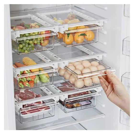 Clear pull-out drawers clipped under fridge shelves, one pulled out holding eggs