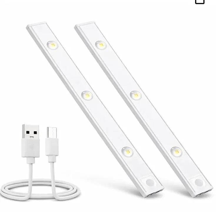 A pair of slim white LED bars with a motion sensor, and the USB cable that charges them