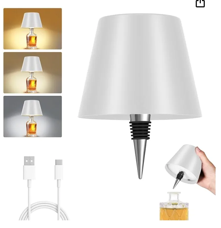 A lamp shade that screws into any bottle like a stopper, shown lit on a glass decanter