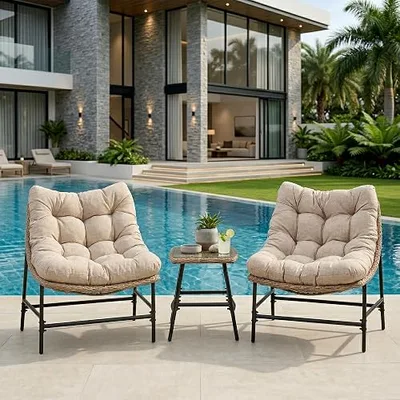 Two cushioned patio chairs with a small table