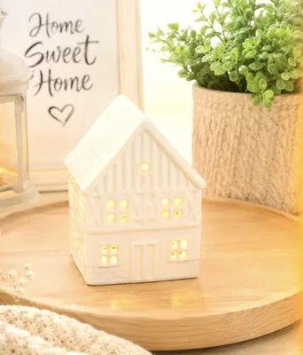 White ceramic house-shaped tealight holder