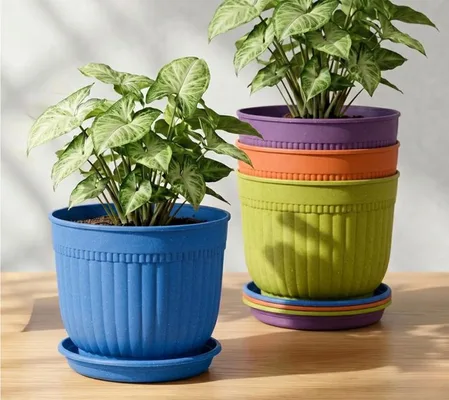 Blue, purple and green ribbed pots with saucers