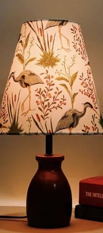 Table lamp with a printed crane shade