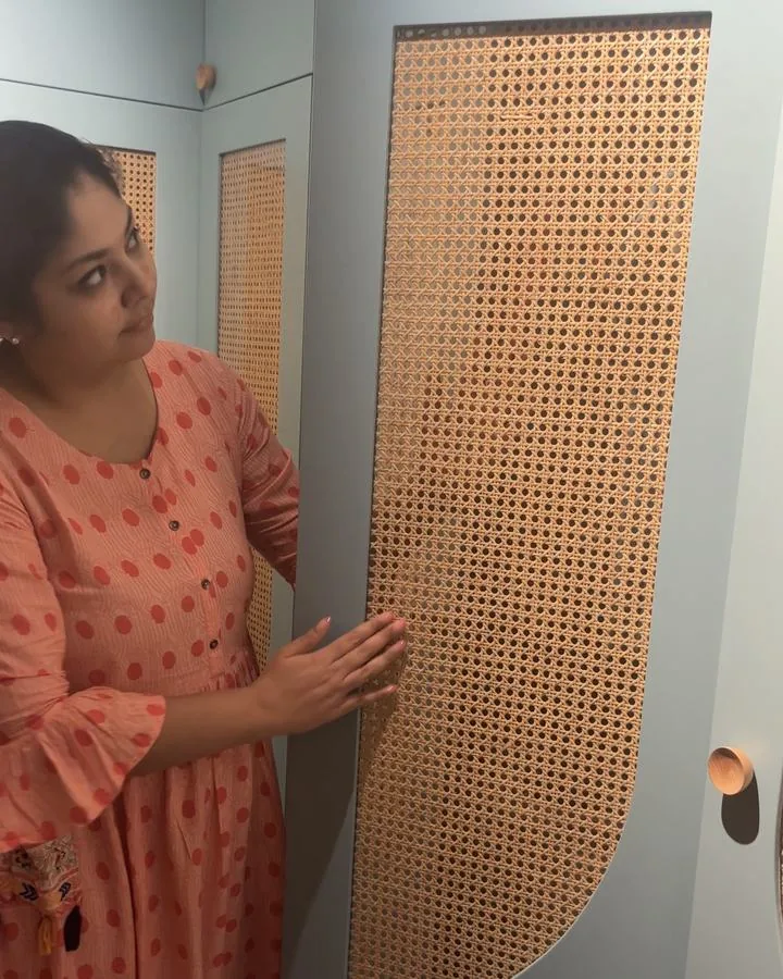 Cane wardrobe shutter set behind glass
